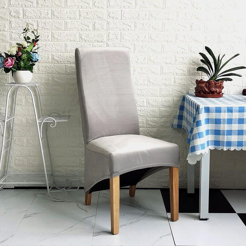 Elegant XL stretch velvet dining chair cover in camel, showcases plush velvet texture, ideal for home or events, fits armless