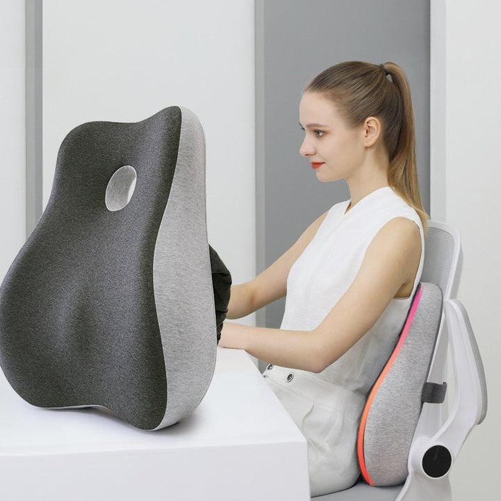 Ergonomic memory foam support cushion for office and car use; contoured design with removable cover for ultimate comfort.