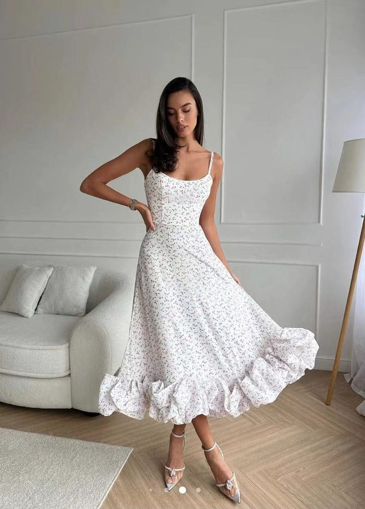 "Exquisite women's midi dress with 3D floral embellishments, A-line silhouette, sleeveless bustier top, ideal for events."