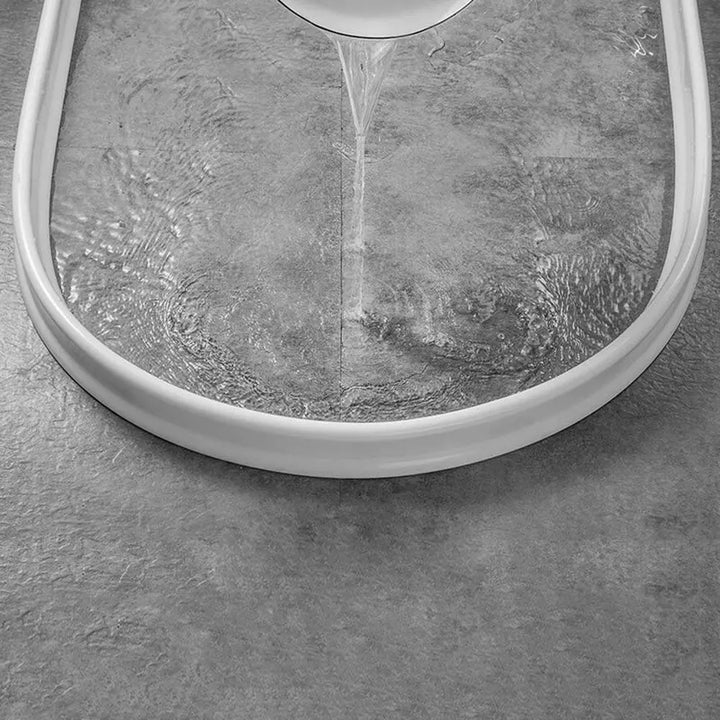 "Flexible waterproof silicone shower seal for leak prevention, shown in sleek design, ideal for bathroom water barrier."