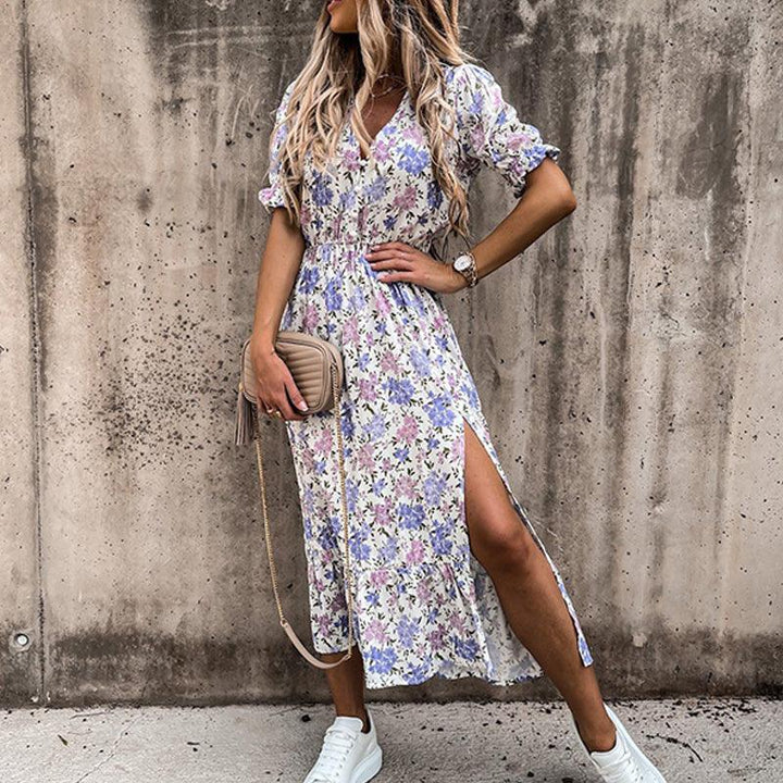 Floral button-front maxi dress with side slit, vibrant floral print, perfect for casual or formal occasions.