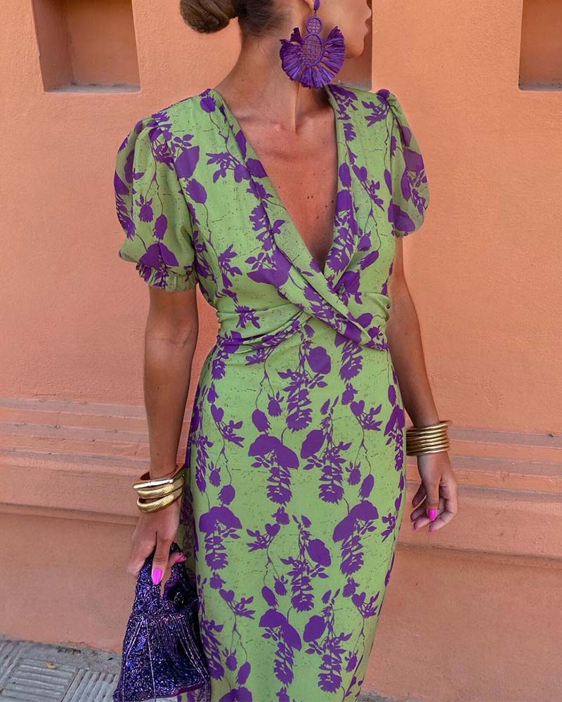 Floral puff sleeve midi dress; vibrant boho style with airy fabric. Ideal for sunny days, featuring colorful flower patterns.