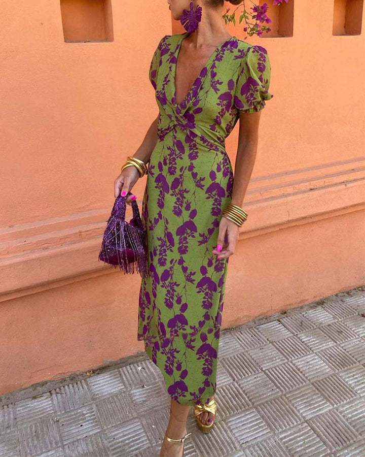 Floral puff sleeve midi dress; vibrant boho style with airy fabric. Ideal for sunny days, featuring colorful flower patterns.