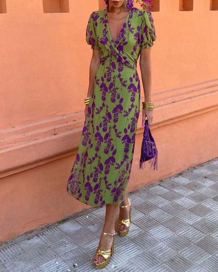 Floral puff sleeve midi dress; vibrant boho style with airy fabric. Ideal for sunny days, featuring colorful flower patterns.