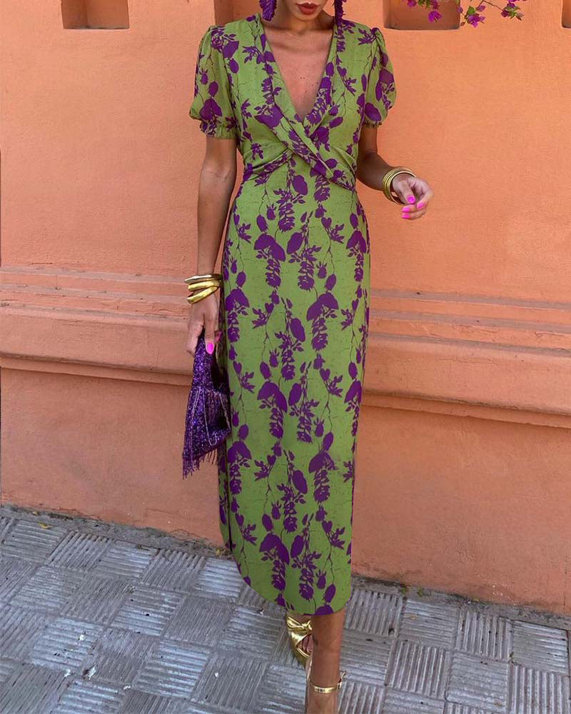 Floral puff sleeve midi dress; vibrant boho style with airy fabric. Ideal for sunny days, featuring colorful flower patterns.
