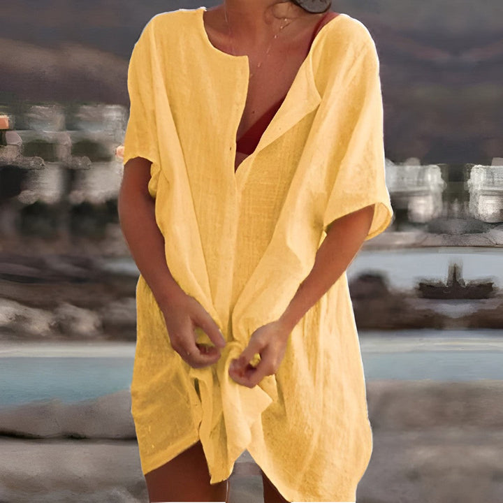 Flowy lightweight beach cover-up dress in vibrant colors and relaxed fit, perfect for layering over swimsuits in summer.