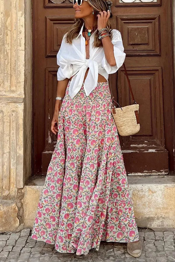 "Flowy women's boho floral print maxi skirt with vibrant colors, perfect for casual outings and summer style."