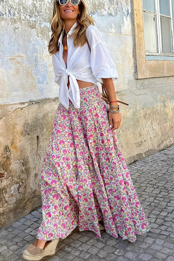 "Flowy women's boho floral print maxi skirt with vibrant colors, perfect for casual outings and summer style."