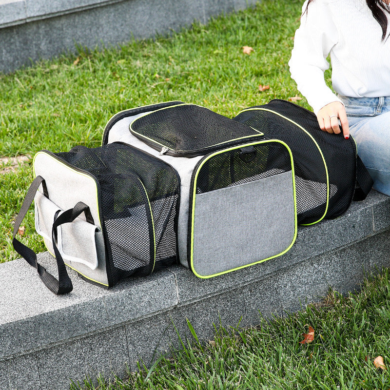 Foldable pet carrier bag with mesh inserts, soft materials, and secure zippers; ideal for comfortable and safe pet travel.