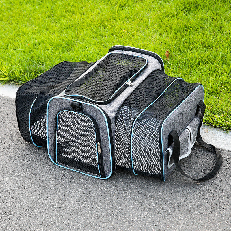 Foldable pet carrier bag with mesh inserts, soft materials, and secure zippers; ideal for comfortable and safe pet travel.