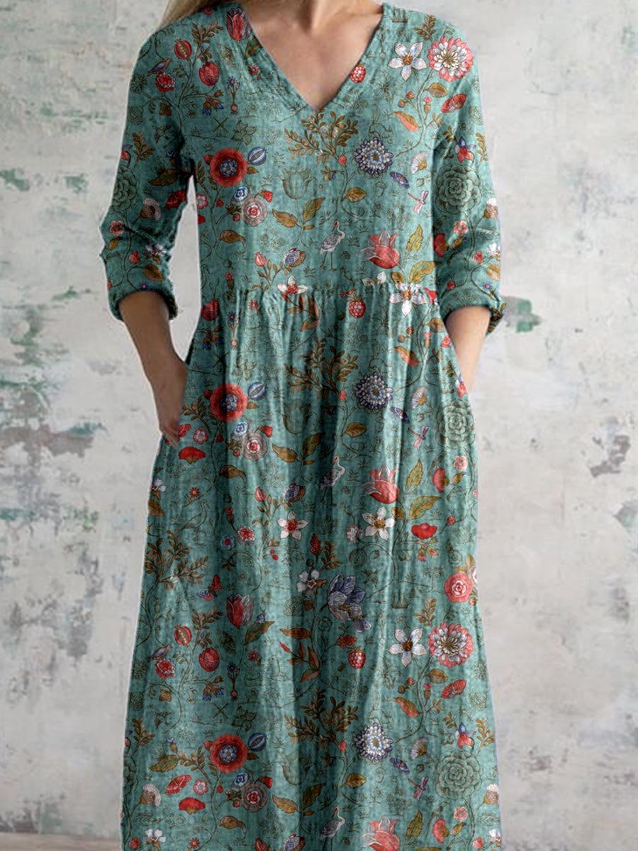 "Front view of floral V-neck empire waist summer dress with short sleeves, ideal for warm weather and elegant occasions."