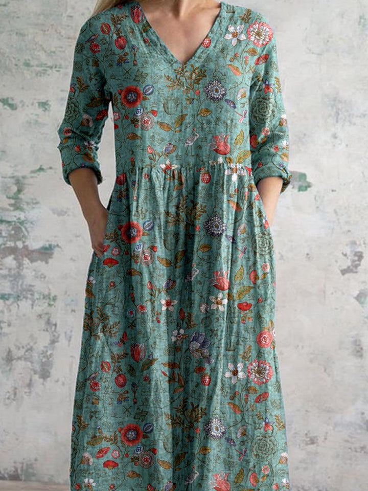 "Front view of floral V-neck empire waist summer dress with short sleeves, ideal for warm weather and elegant occasions."