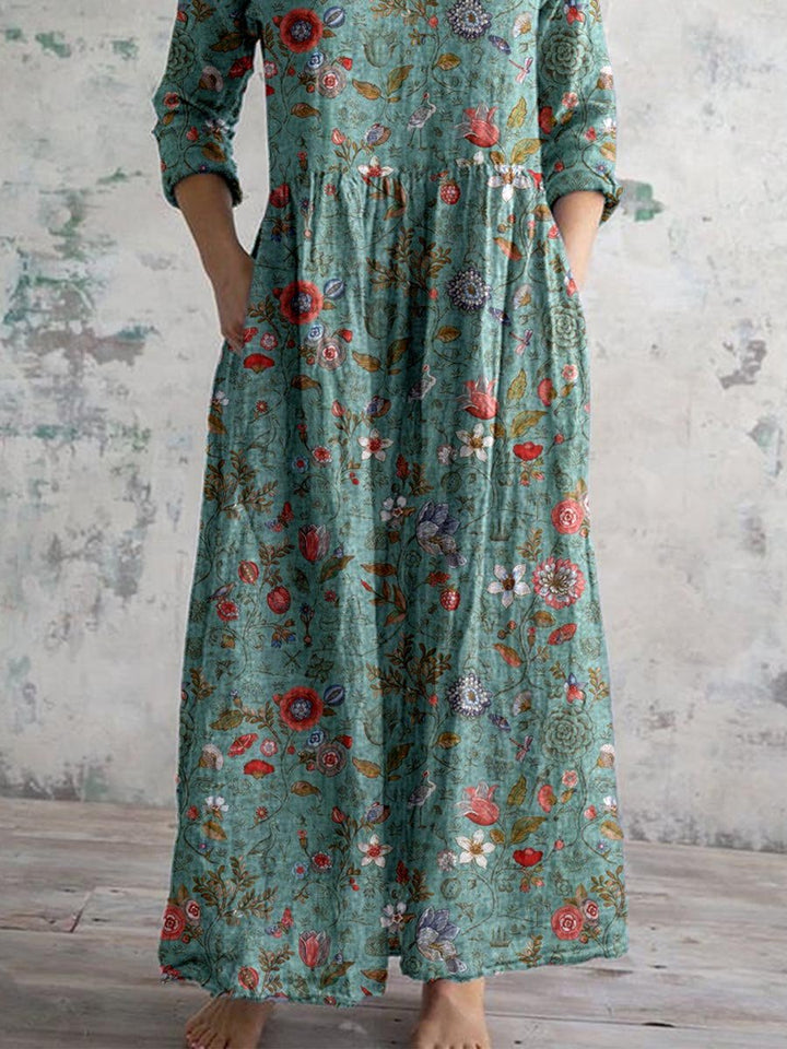 "Front view of floral V-neck empire waist summer dress with short sleeves, ideal for warm weather and elegant occasions."