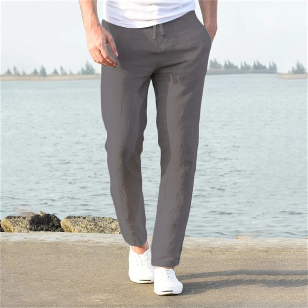 Gray lightweight linen summer pants with elastic waistband and pockets, perfect for men's casual or beach wear.
