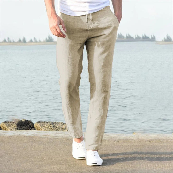 Gray lightweight linen summer pants with elastic waistband and pockets, perfect for men's casual or beach wear.