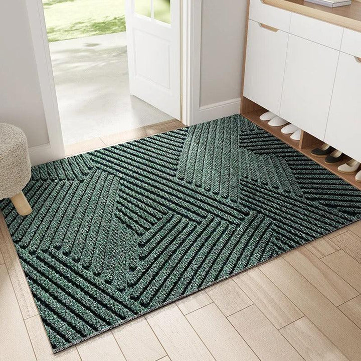 "Green non-slip heavy-duty door mat with textured surface for indoor/outdoor use, resists dirt, rain, and sun exposure."