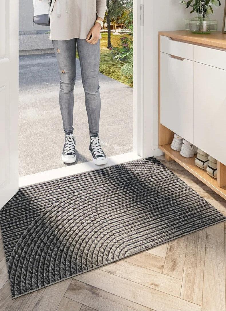 "Green non-slip heavy-duty door mat with textured surface for indoor/outdoor use, resists dirt, rain, and sun exposure."