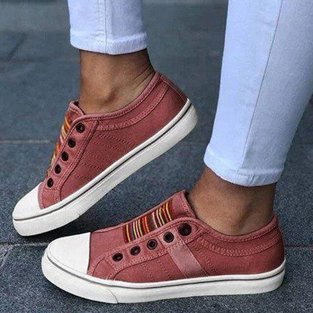 "Grey sneakers for women, stylish and comfy, perfect for everyday wear with a modern look and cushioned soles."