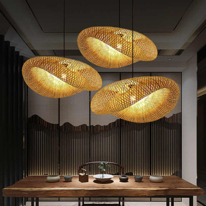 "Handcrafted bamboo pendant light with wave-pattern wicker rattan shade, adds warm, natural elegance to any interior space."