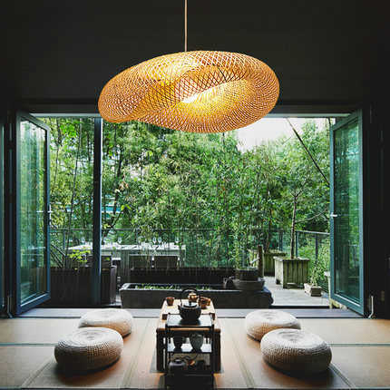 "Handcrafted bamboo pendant light with wave-pattern wicker rattan shade, adds warm, natural elegance to any interior space."