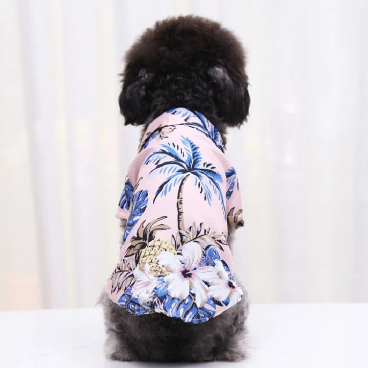 Hawaiian dog shirt with vibrant tropical patterns, featuring pineapples and foliage in bold colors for pet summer style.