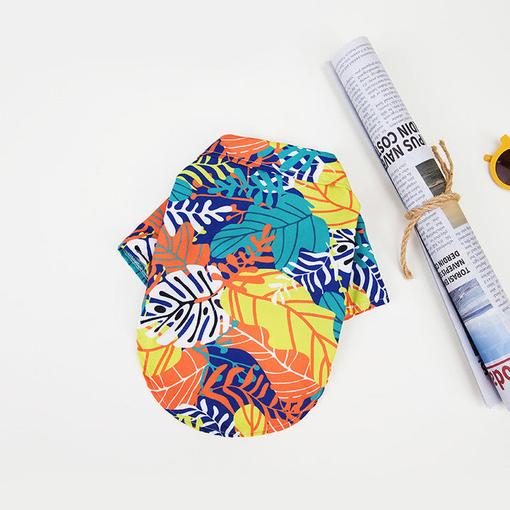 Hawaiian dog shirt with vibrant tropical patterns, featuring pineapples and foliage in bold colors for pet summer style.