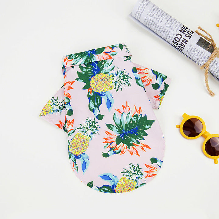 Hawaiian dog shirt with vibrant tropical patterns, featuring pineapples and foliage in bold colors for pet summer style.