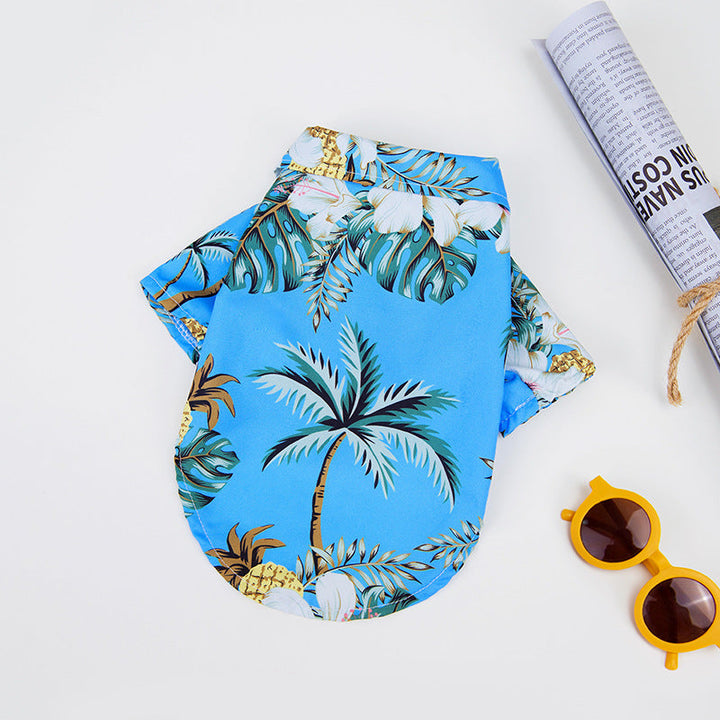 Hawaiian dog shirt with vibrant tropical patterns, featuring pineapples and foliage in bold colors for pet summer style.