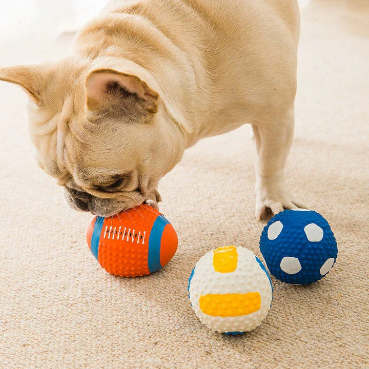 "Indestructible sports-themed chewballs for dogs in football, volleyball, rugby, and baseball designs - 4 pack set."