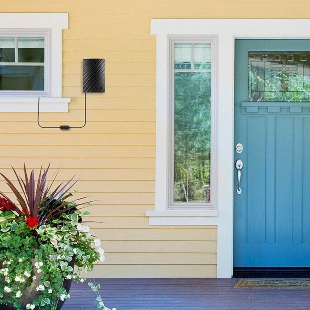 "Indoor 4K HDTV antenna, sleek black design, up to 600 miles range, with coaxial cable, fits modern living spaces."