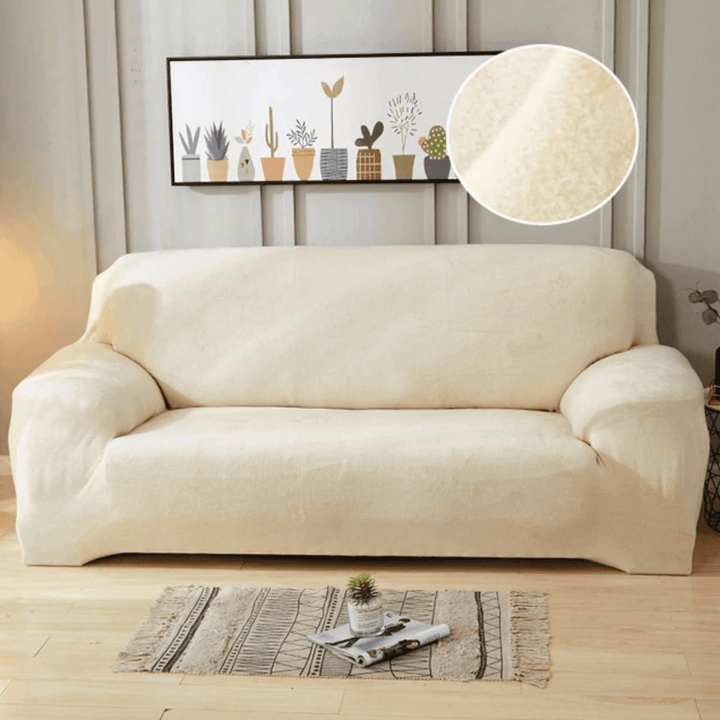 Ivory Plush Sofa Cover showing versatile fit on an L-shaped sofa, enhancing style with soft, luxurious material.