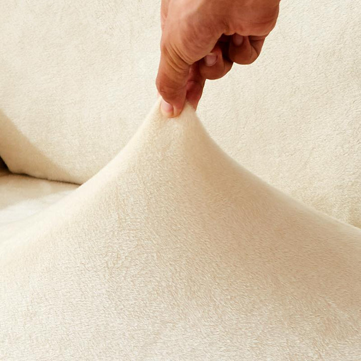 Ivory Plush Sofa Cover showing versatile fit on an L-shaped sofa, enhancing style with soft, luxurious material.
