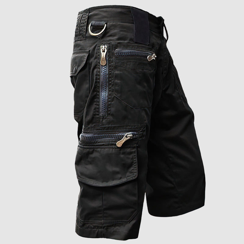 Knee-length men’s cargo shorts in durable cotton with multiple utility pockets, side view for outdoor style and function.
