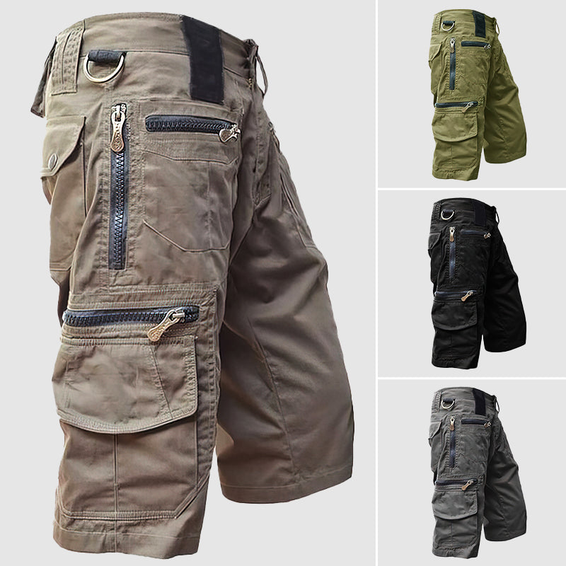 Knee-length men’s cargo shorts in durable cotton with multiple utility pockets, side view for outdoor style and function.