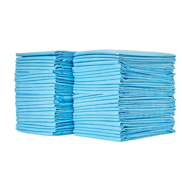 "Leak-proof potty training pads for dogs, featuring multi-layer design and non-slip bottom, shown on clean wooden floor."