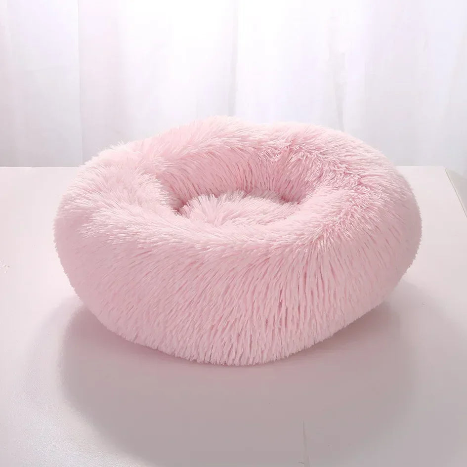 "Light grey premium dog bed offering comfort for pets, featuring plush design and elevated edges for head and neck support."