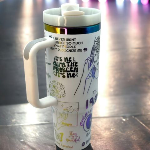 "Limited edition stainless steel tumbler with custom design, handwritten lyrics, vibrant colors, and ergonomic handle."