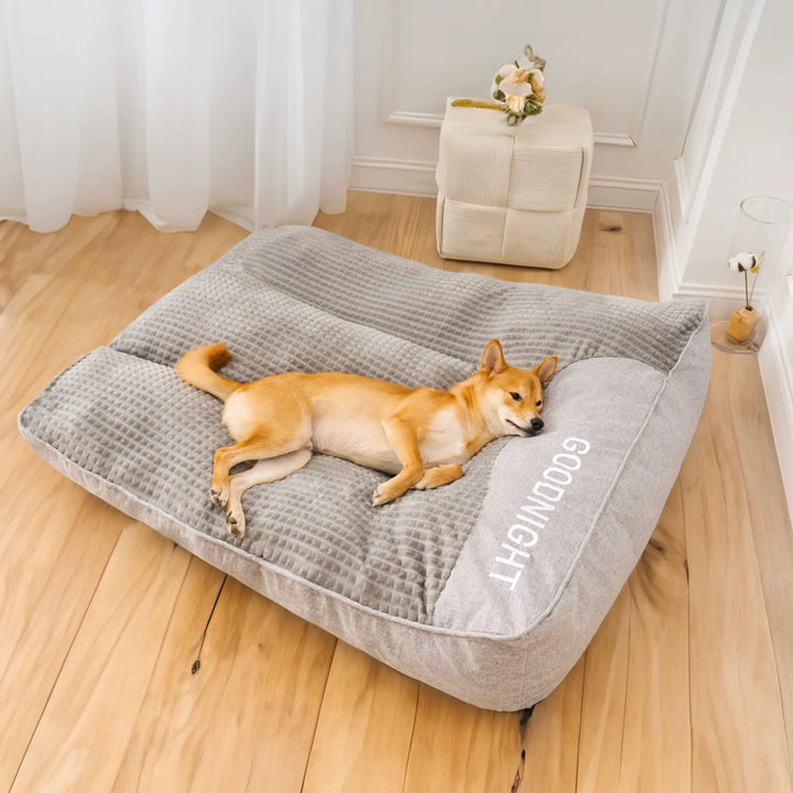 "Luxurious calming washable dog cushion in soft faux fur, available in sizes for all dogs, promotes stress-free relaxation."