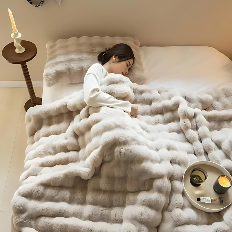 "Luxurious double-sided fleece and faux fur blanket for ultimate warmth, soft texture; ideal bedding or decorative throw."