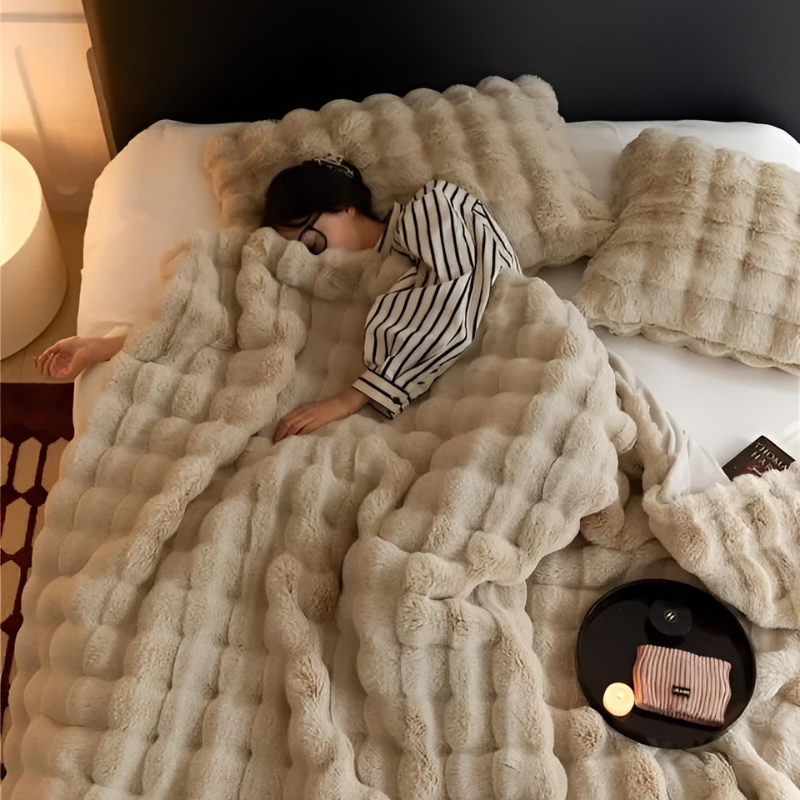 "Luxurious double-sided fleece and faux fur blanket for ultimate warmth, soft texture; ideal bedding or decorative throw."