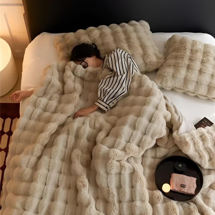 "Luxurious double-sided fleece and faux fur blanket for ultimate warmth, soft texture; ideal bedding or decorative throw."