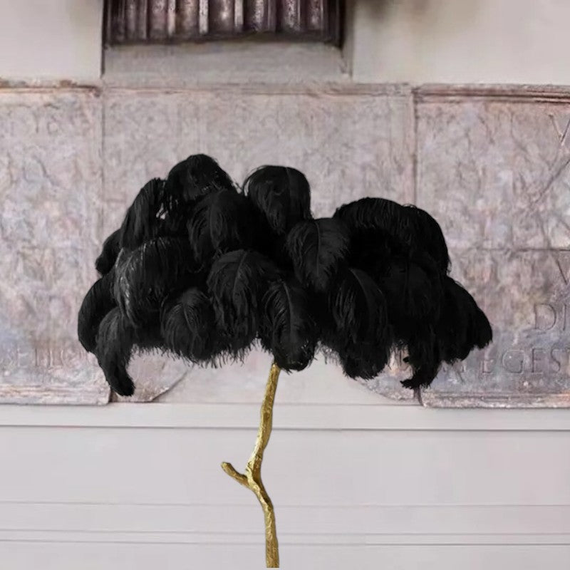 Luxurious Ostrich Feather Floor Lamp with cascading feathers, polished brass finish, and resin base for elegant home lighting