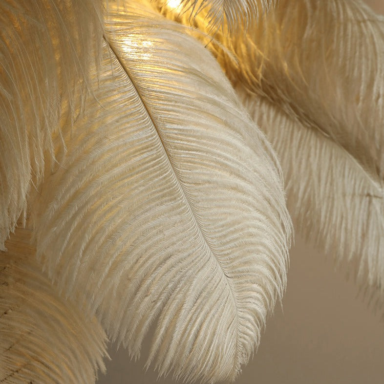 Luxurious Ostrich Feather Floor Lamp with cascading feathers, polished brass finish, and resin base for elegant home lighting