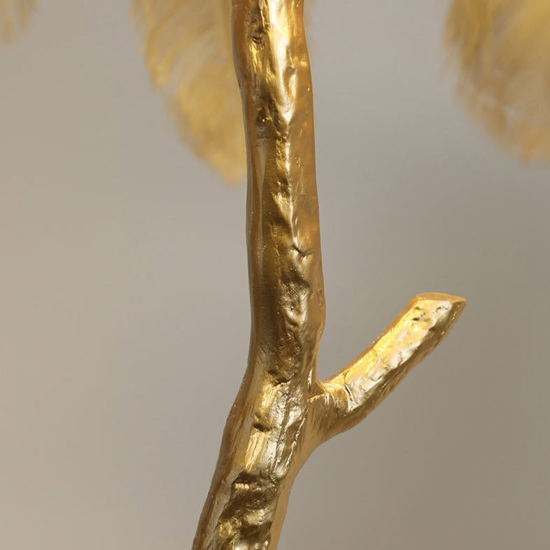 Luxurious Ostrich Feather Floor Lamp with cascading feathers, polished brass finish, and resin base for elegant home lighting