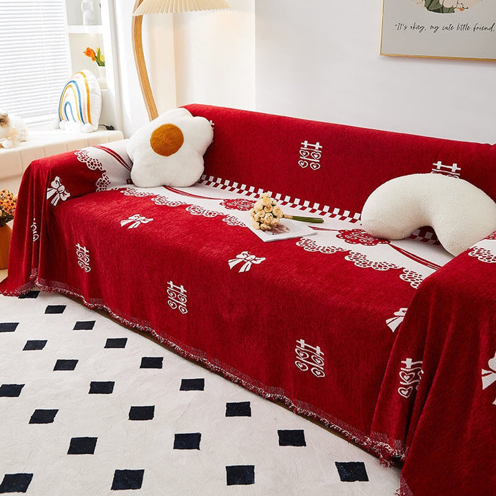 "Luxurious Rosy Sofa Throw Cover; stretchable, durable fabric; protects sofa; elegant design; seamless fit."