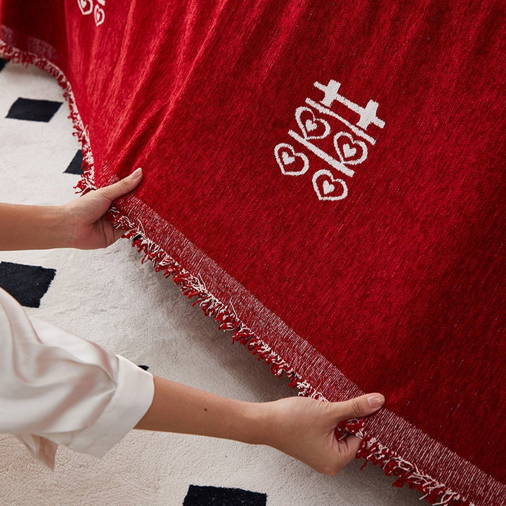 "Luxurious Rosy Sofa Throw Cover; stretchable, durable fabric; protects sofa; elegant design; seamless fit."