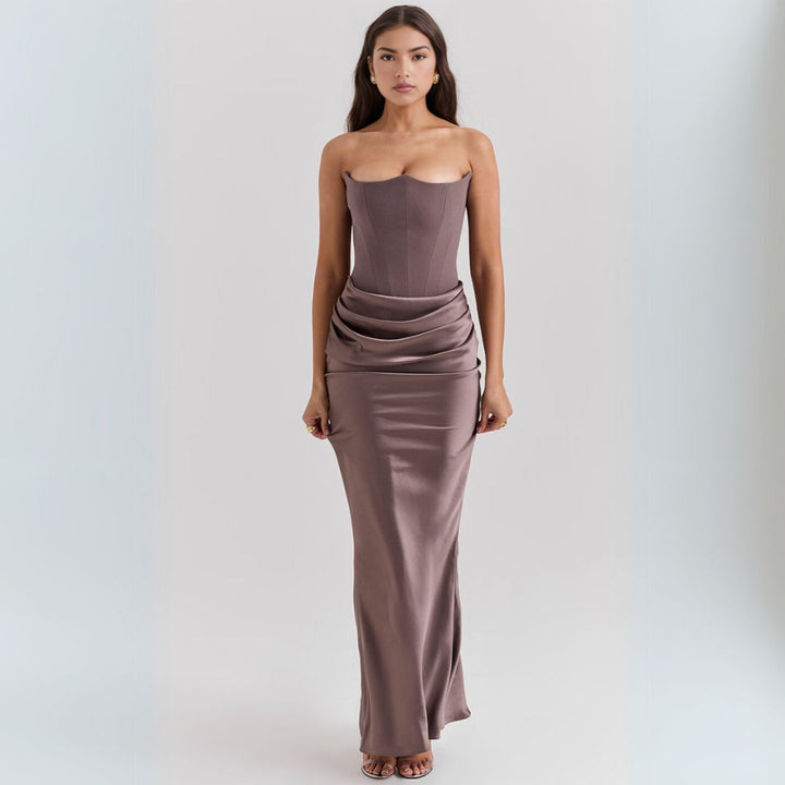Luxurious satin strapless corset maxi dress, features dramatic draped hip detail, elegant silhouette, perfect for occasions.