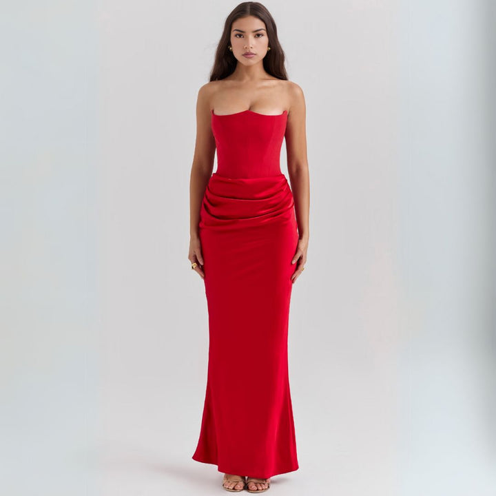 Luxurious satin strapless corset maxi dress, features dramatic draped hip detail, elegant silhouette, perfect for occasions.