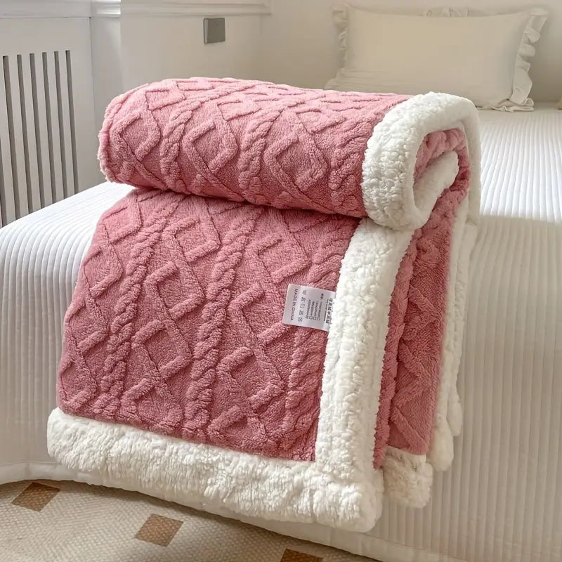 Luxurious sherpa blanket with plush, soft texture, reversible design; perfect for cozy all-season comfort and decoration.
