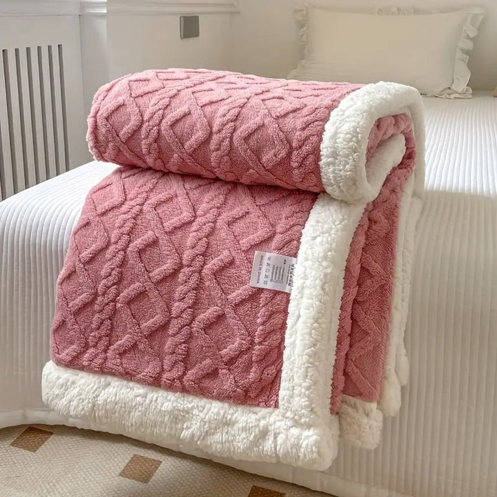 Luxurious sherpa blanket with plush, soft texture, reversible design; perfect for cozy all-season comfort and decoration.